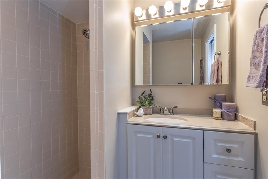 22 Westfield Lane Palm Coast, FL 32164 - Photo 29 of 47 a bathroom with a sink and a mirror
