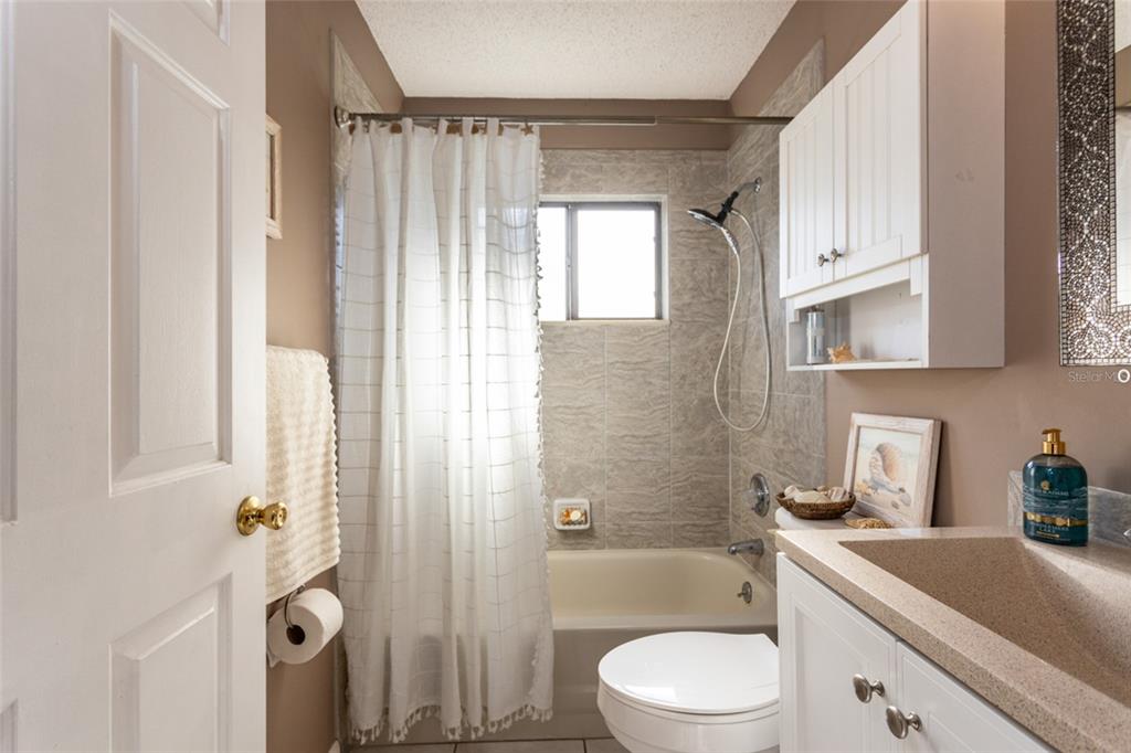 22 Westfield Lane Palm Coast, FL 32164 - Photo 34 of 47 a bathroom with a sink a toilet and shower