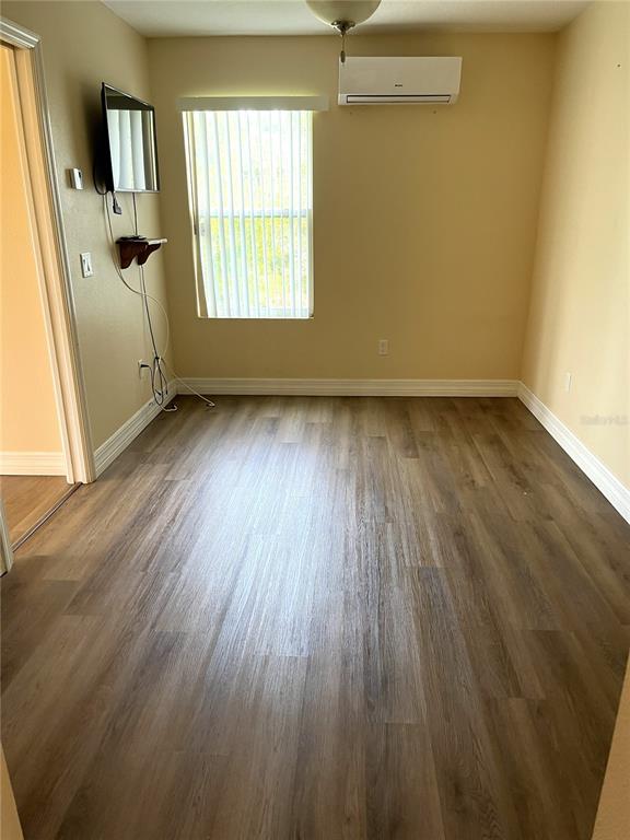 22 Westfield Lane Palm Coast, FL 32164 - Photo 42 of 47 an empty room with wooden floor and windows