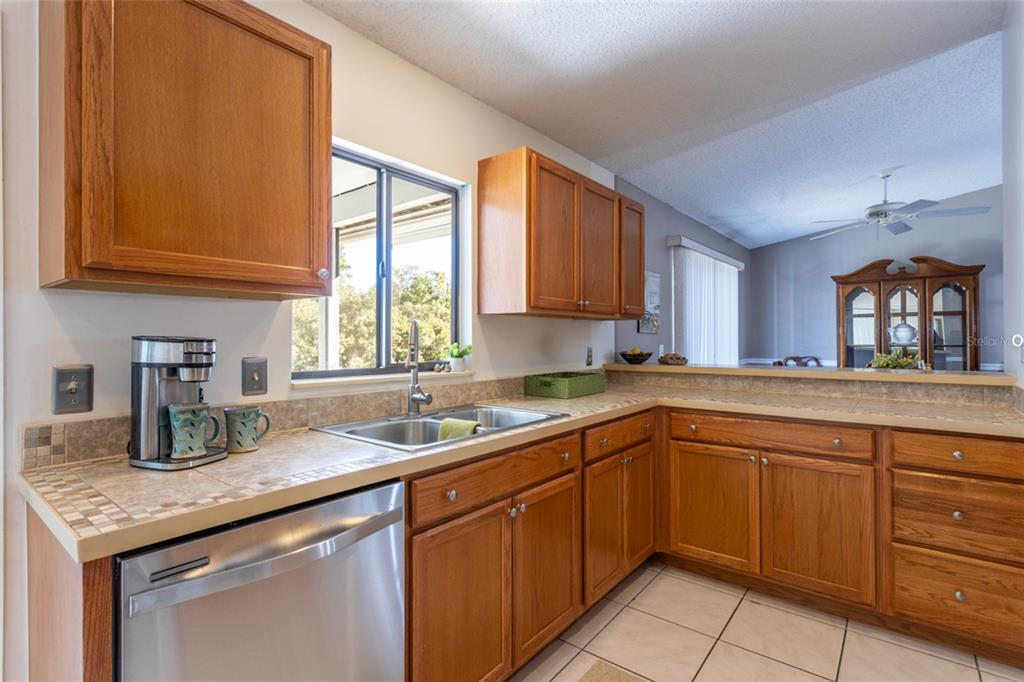 22 Westfield Lane Palm Coast, FL 32164 - Photo 5 of 47 a kitchen with a sink cabinets and window