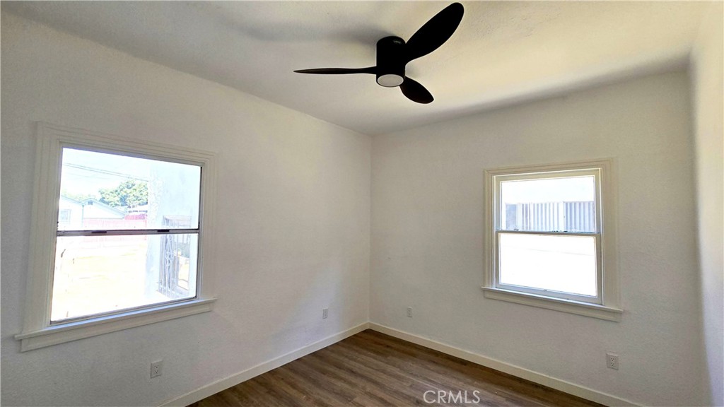 973 North Pk Circle, Unit 5 Long Beach, CA 90813 - Photo 5 of 9 a view of empty room with wooden floor and window