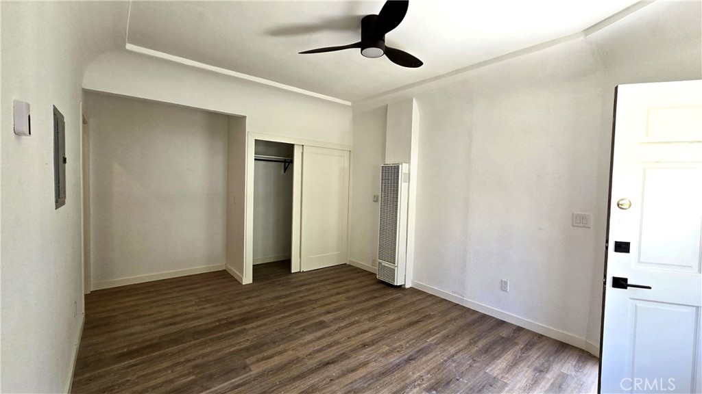 973 North Pk Circle, Unit 5 Long Beach, CA 90813 - Photo 8 of 9 a view of an empty room with wooden floor