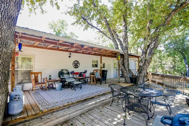 a view of a dinning table and chairs in the patio