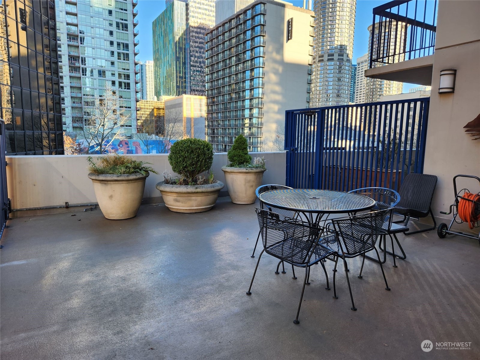 2100 3rd Avenue, Unit 2106 Seattle, WA 98121 - Photo 16 of 25 a view of a patio with couple of chairs