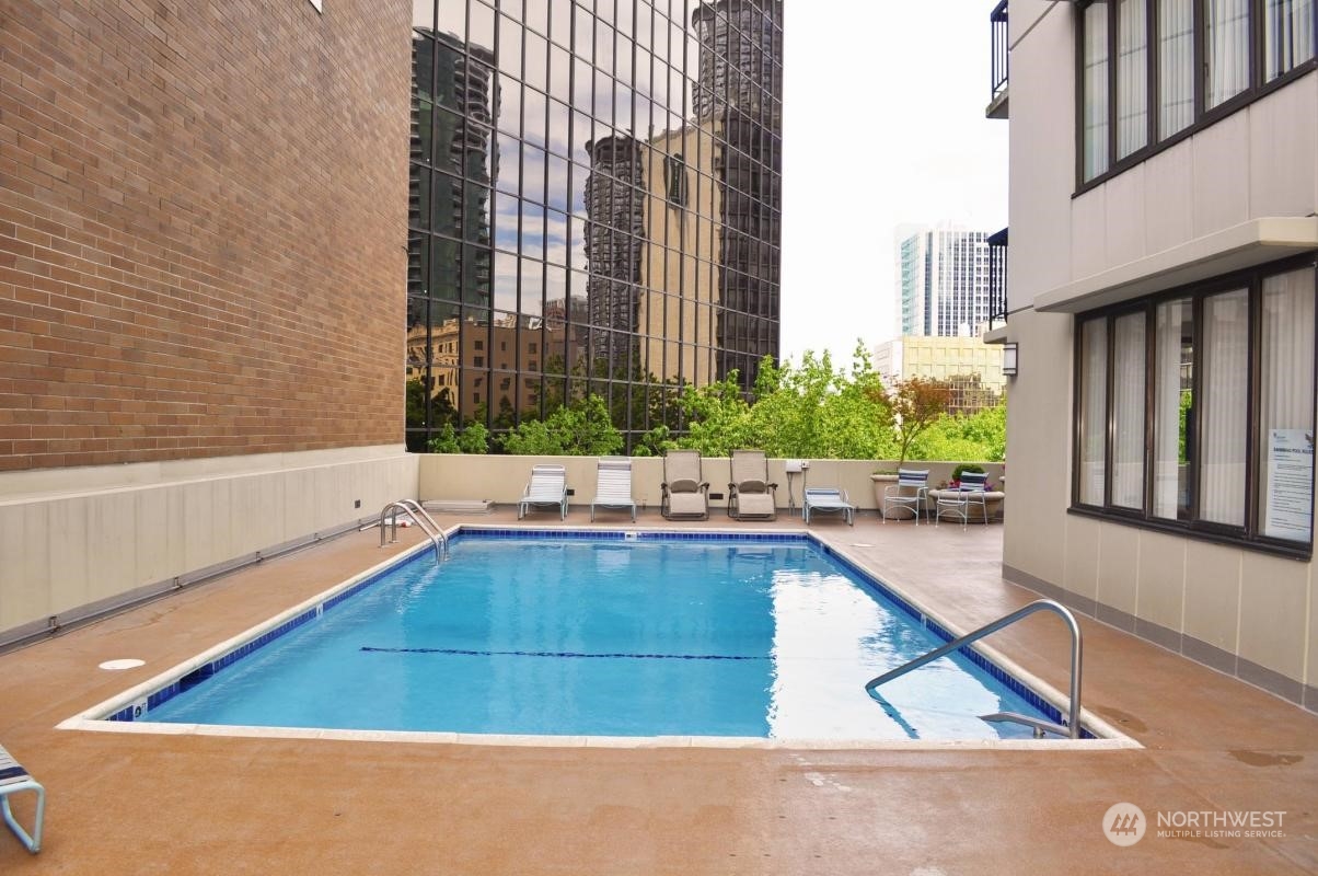 2100 3rd Avenue, Unit 2106 Seattle, WA 98121 - Photo 24 of 25 a swimming pool with outdoor seating and plants
