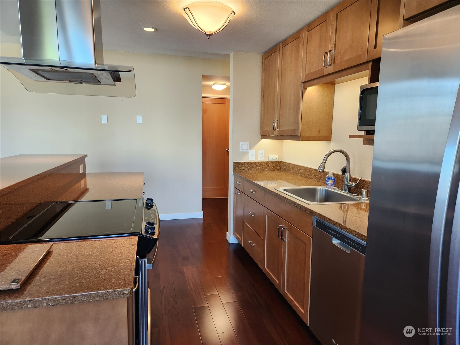 2100 3rd Avenue, Unit 2106 Seattle, WA 98121 - Photo 3 of 25 a kitchen with sink refrigerator and stove