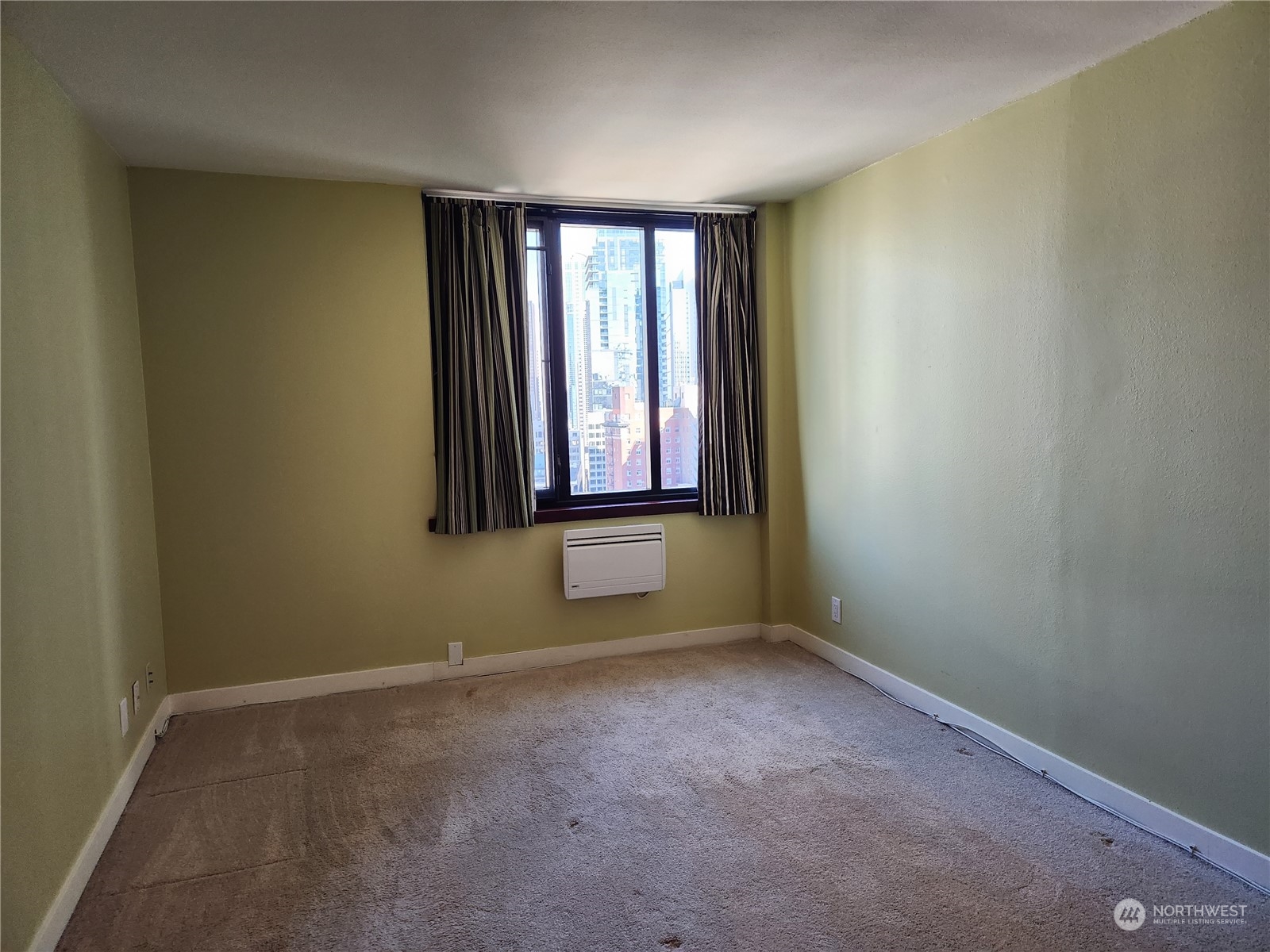 2100 3rd Avenue, Unit 2106 Seattle, WA 98121 - Photo 6 of 25 an empty room with windows