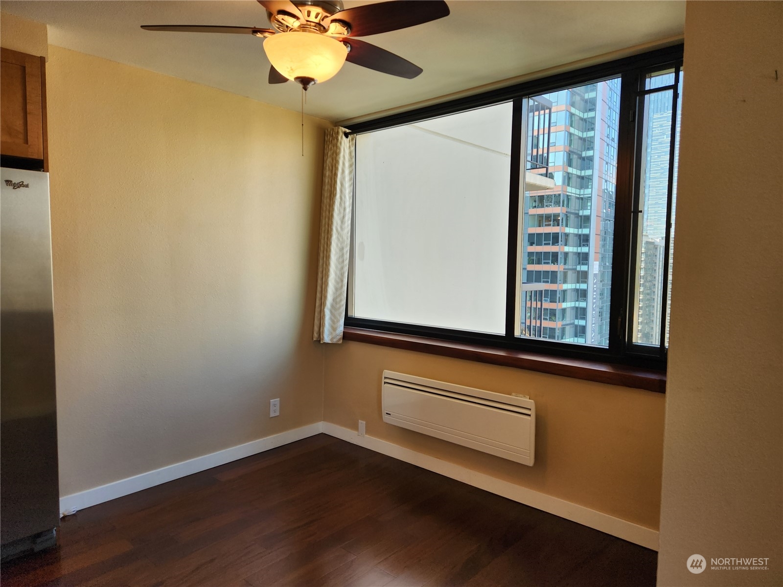 2100 3rd Avenue, Unit 2106 Seattle, WA 98121 - Photo 9 of 25 a view of a room with wooden floor and fan