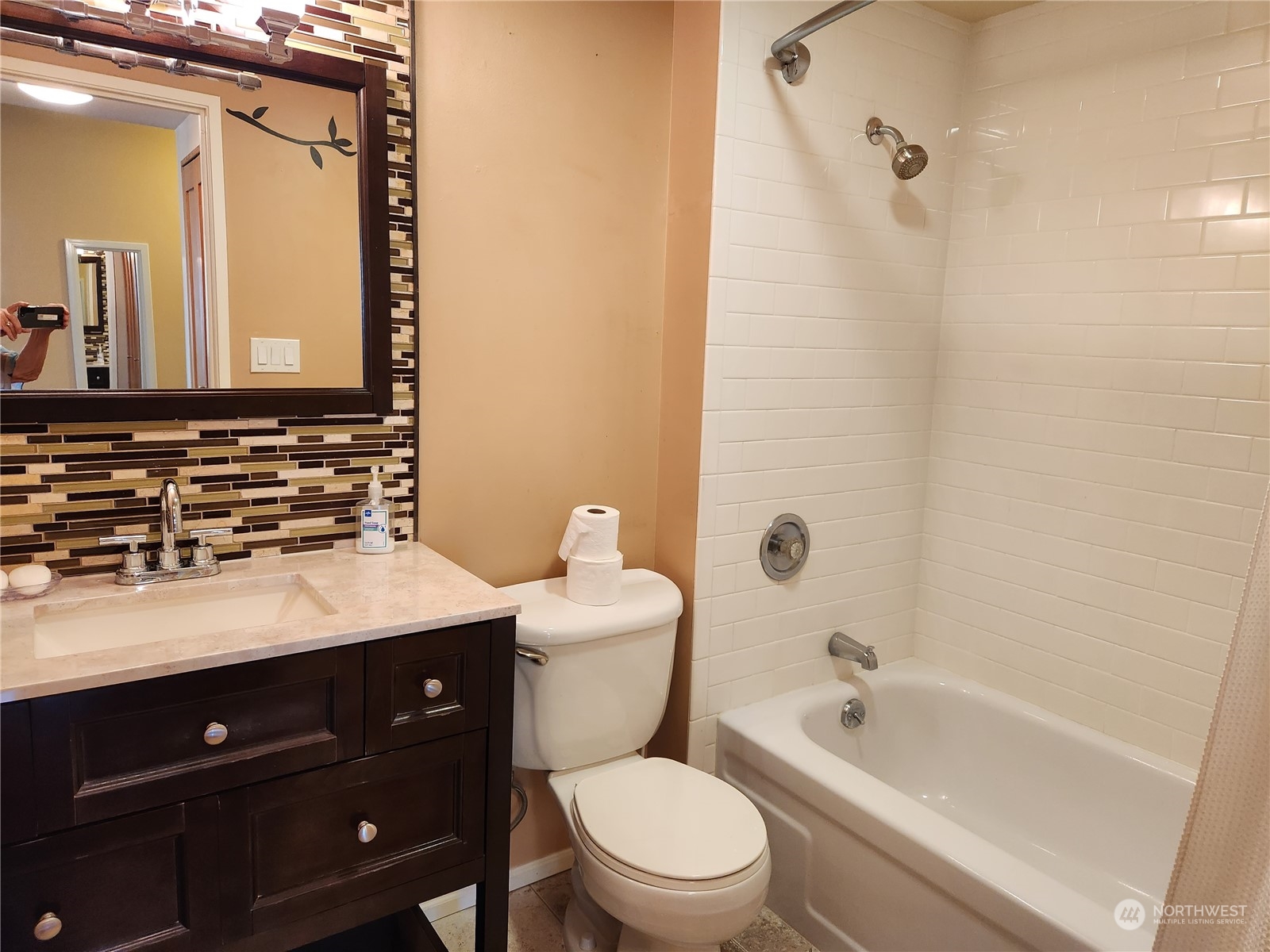 2100 3rd Avenue, Unit 2106 Seattle, WA 98121 - Photo 10 of 25 a bathroom with a sink a toilet a mirror a vanity and shower