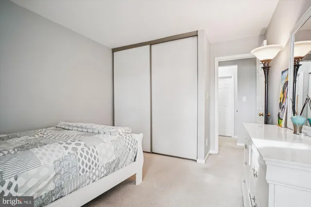 a bedroom with a bed and a sink