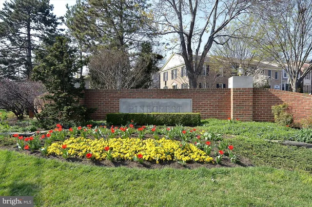 a front view of a house with a yard and outdoor seating
