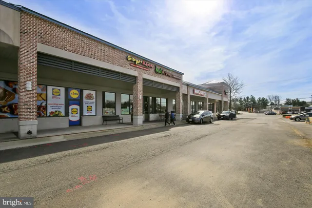 a couple of cars parked in front of building