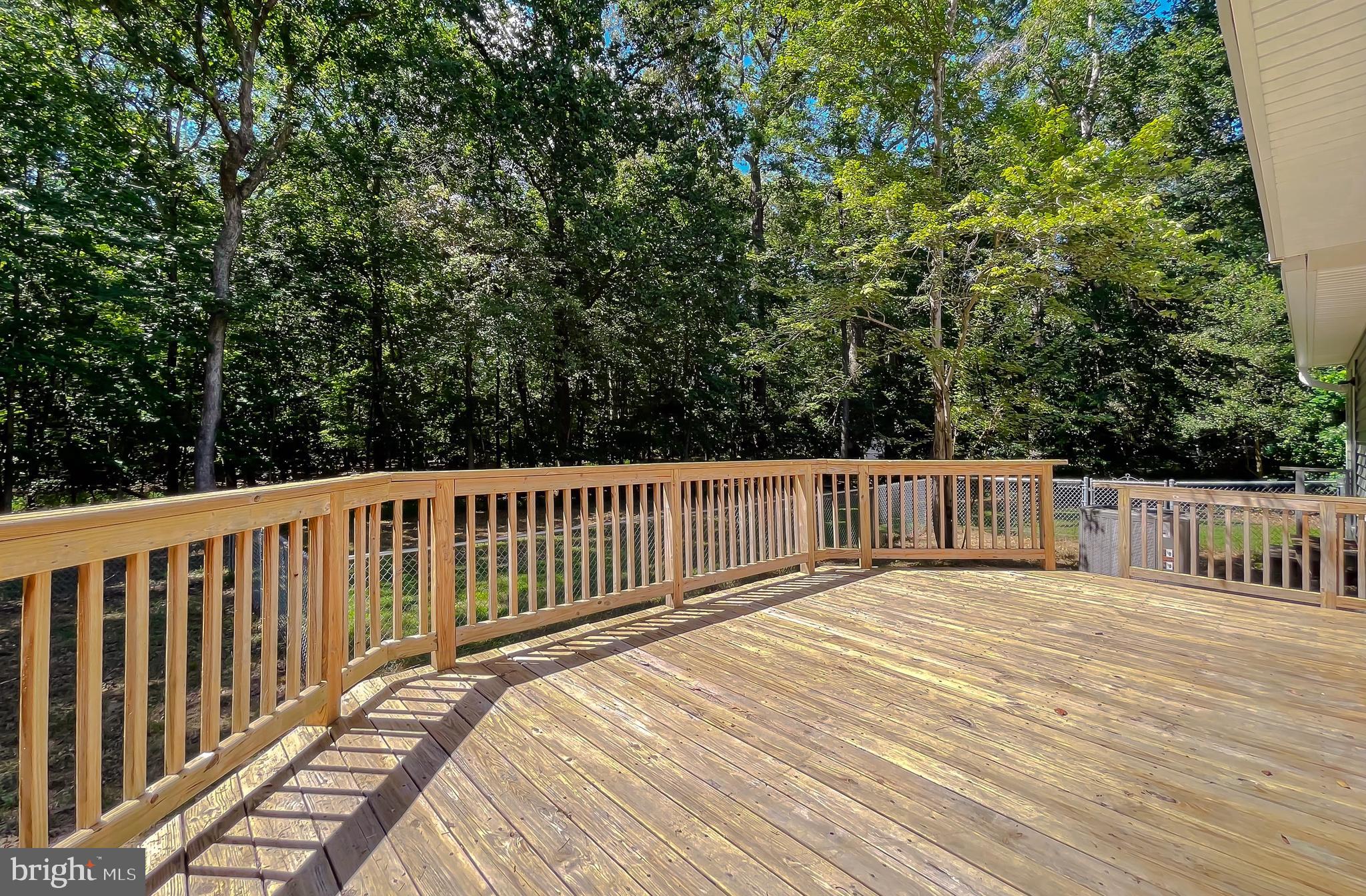 22373 Enoch Road Leonardtown, MD 20650 - Photo 61 of 74 a view of a wooden roof deck