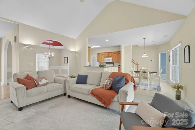 a living room with furniture and a table