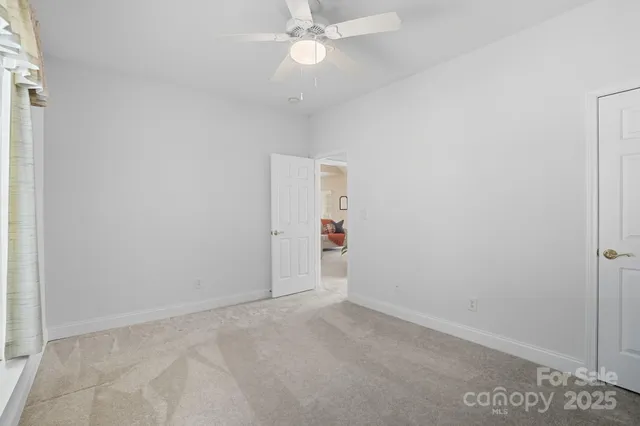 a bathroom with a double vanity sink mirror and toilet