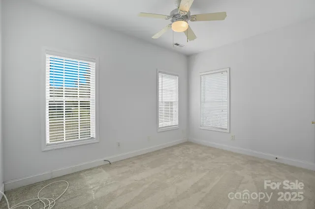 a view of a hallway with a front door