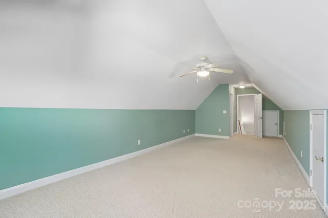 a bathroom with a sink toilet and a mirror