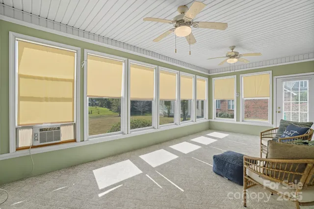 a living room with furniture and windows