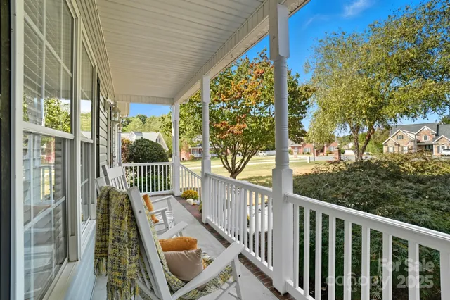 a view of balcony with furniture