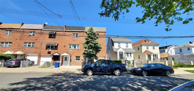 a front view of a building with parking space