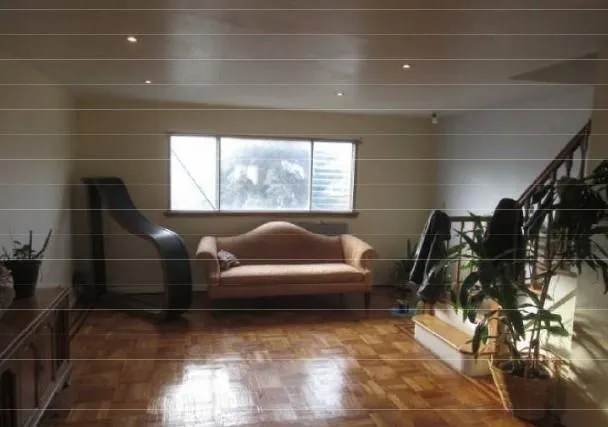 a living room with furniture and a rug