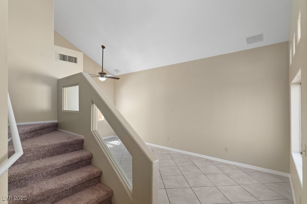 5309 West Camino Del Rancho Las Vegas, NV 89130 - Photo 12 of 41 Stairs with high vaulted ceiling, tile patterned flooring, and a ceiling fan