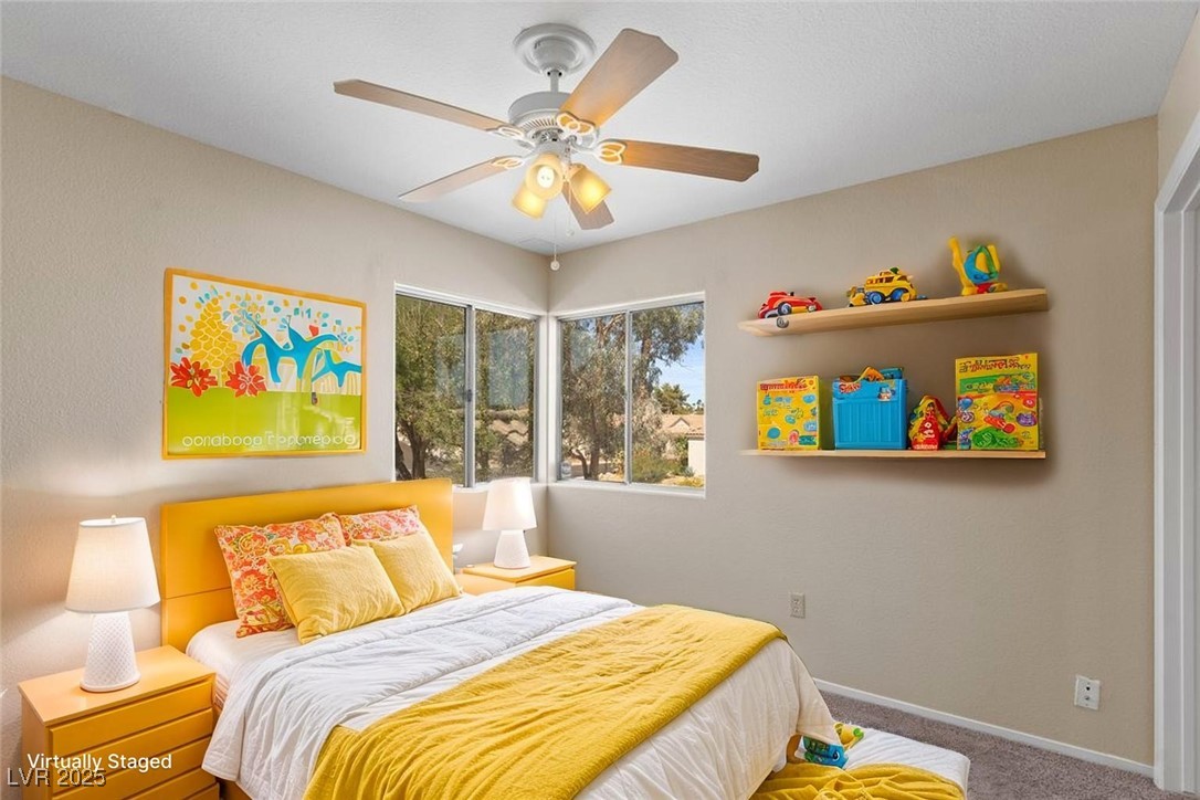 5309 West Camino Del Rancho Las Vegas, NV 89130 - Photo 15 of 41 Carpeted bedroom featuring baseboards and a ceiling fan