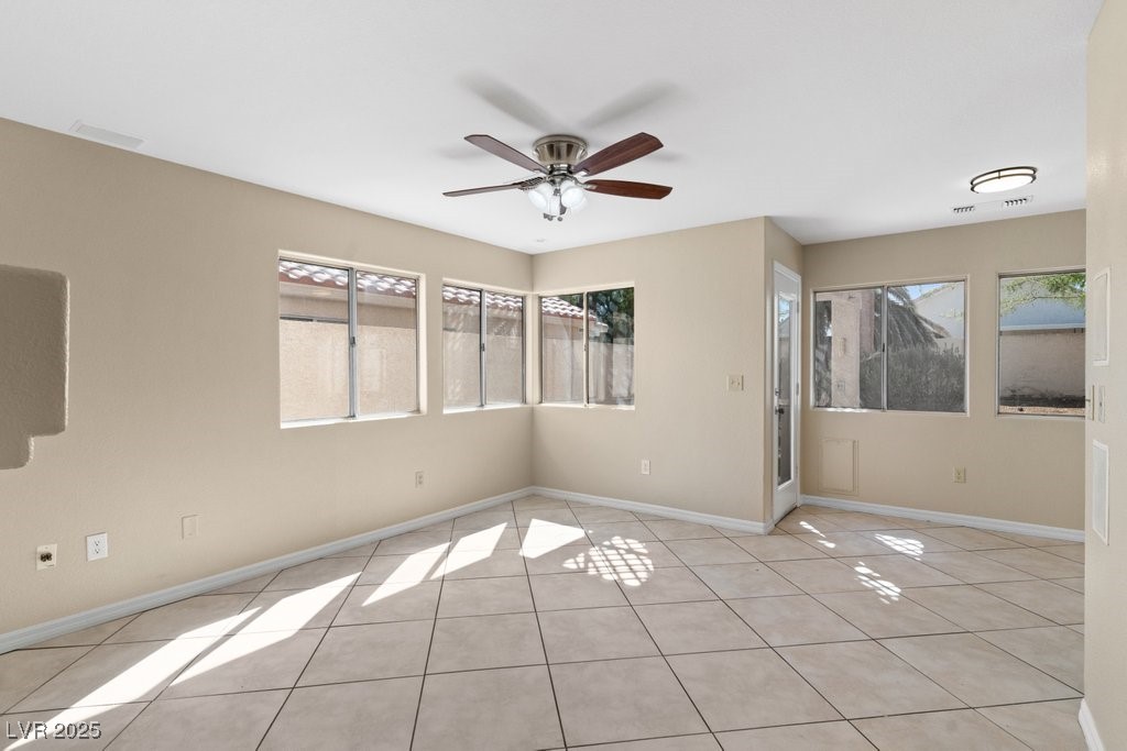 5309 West Camino Del Rancho Las Vegas, NV 89130 - Photo 19 of 41 Unfurnished room with light tile patterned flooring and ceiling fan