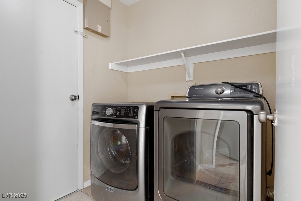 5309 West Camino Del Rancho Las Vegas, NV 89130 - Photo 21 of 41 Washroom featuring independent washer and dryer and light tile patterned flooring