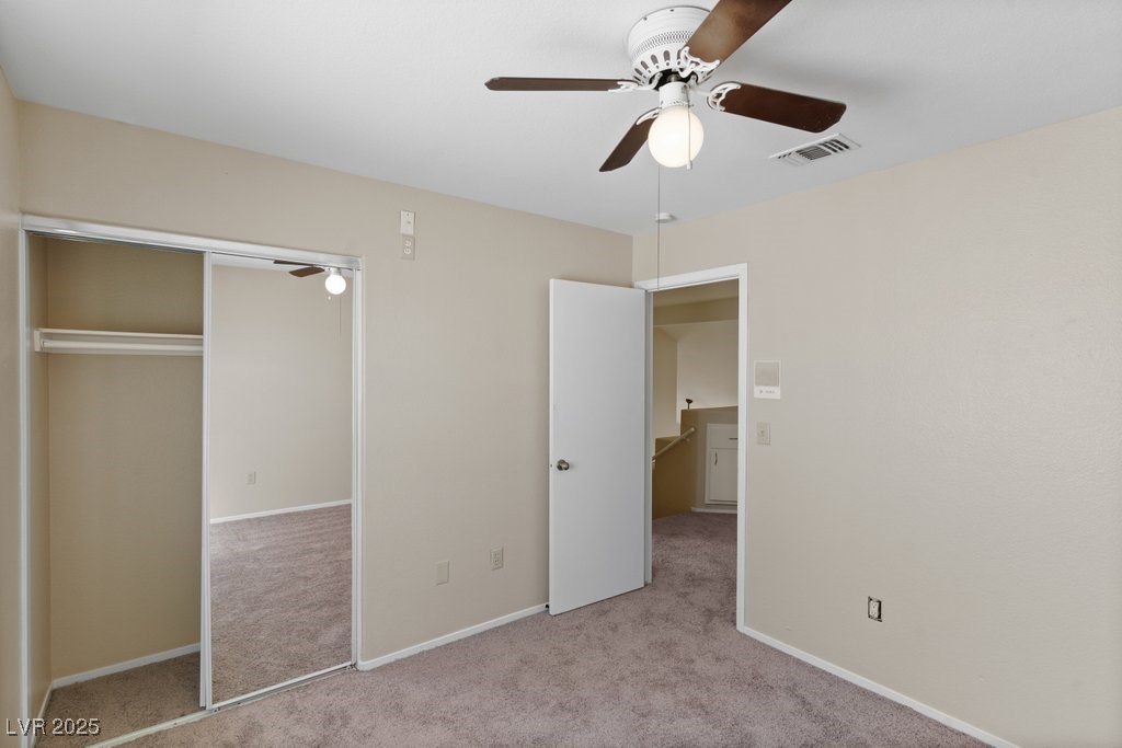 5309 West Camino Del Rancho Las Vegas, NV 89130 - Photo 30 of 41 Unfurnished bedroom featuring carpet flooring, a ceiling fan, and a closet