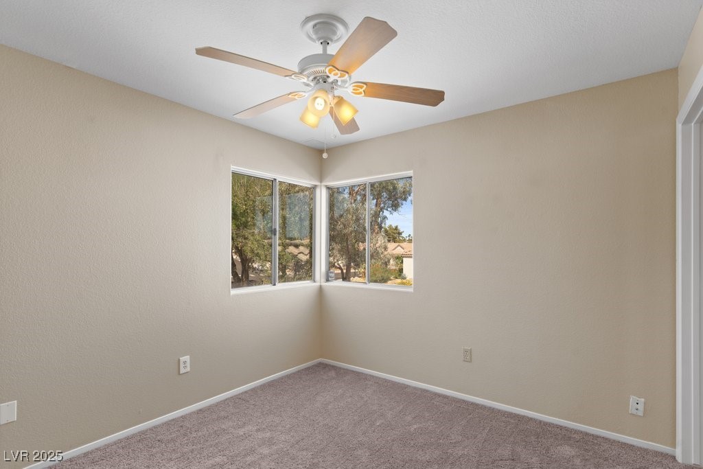 5309 West Camino Del Rancho Las Vegas, NV 89130 - Photo 32 of 41 Carpeted empty room with baseboards and a ceiling fan