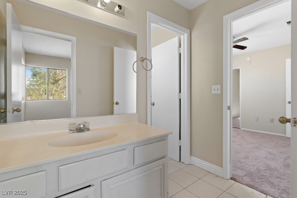 5309 West Camino Del Rancho Las Vegas, NV 89130 - Photo 34 of 41 Bathroom with vanity, light tile patterned floors, and a ceiling fan