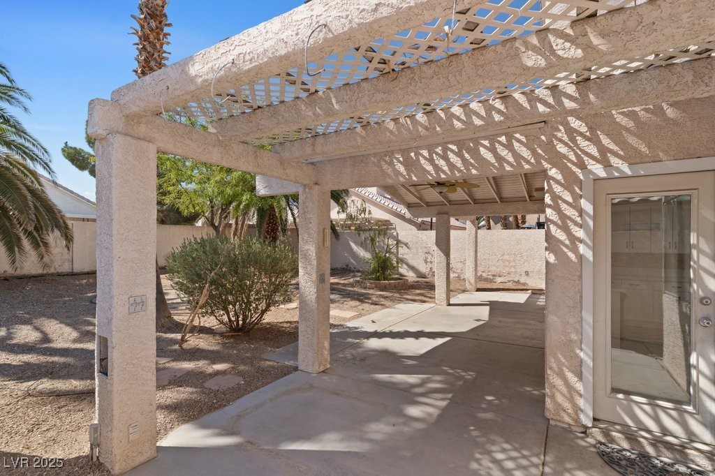 5309 West Camino Del Rancho Las Vegas, NV 89130 - Photo 36 of 41 Fenced backyard featuring a patio and a pergola