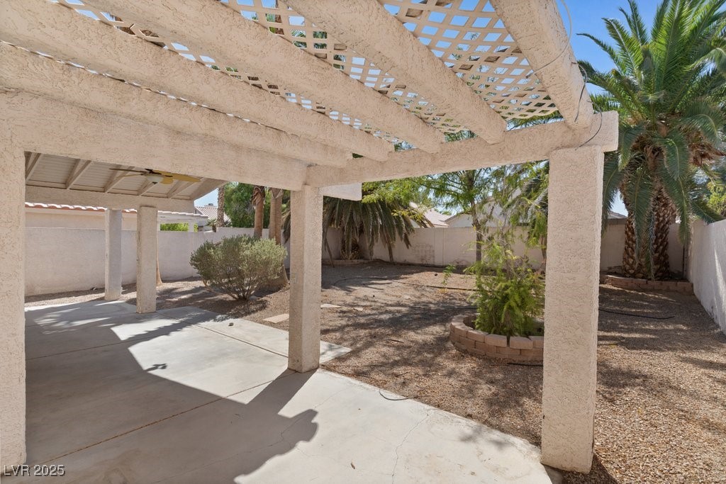 5309 West Camino Del Rancho Las Vegas, NV 89130 - Photo 37 of 41 Fenced backyard featuring a pergola and a patio area
