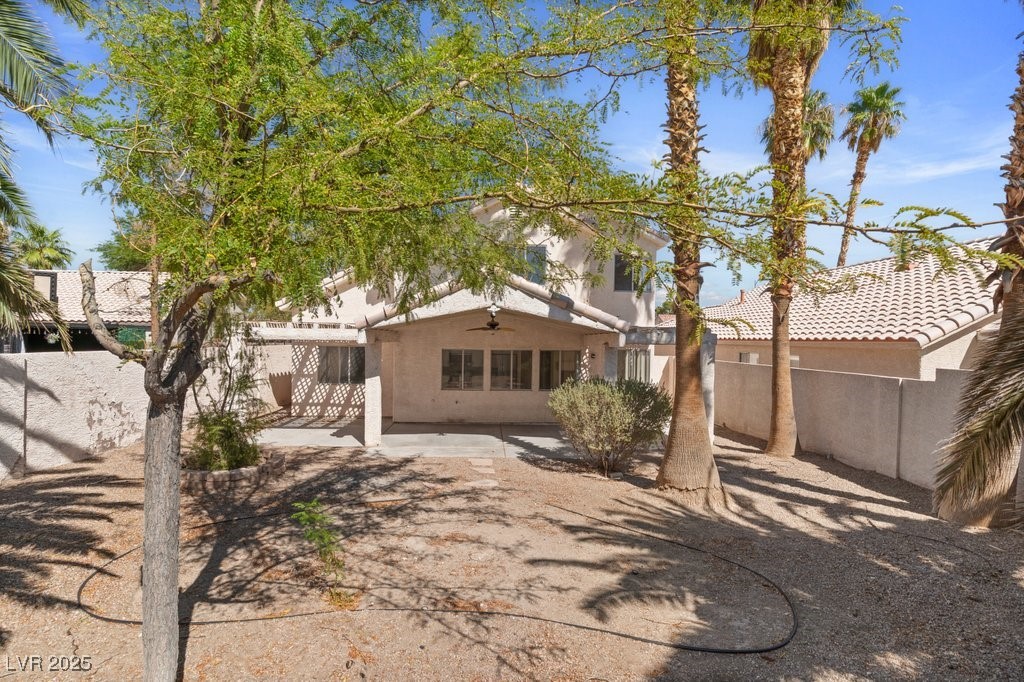 5309 West Camino Del Rancho Las Vegas, NV 89130 - Photo 38 of 41 Back of property featuring stucco siding and a ceiling fan