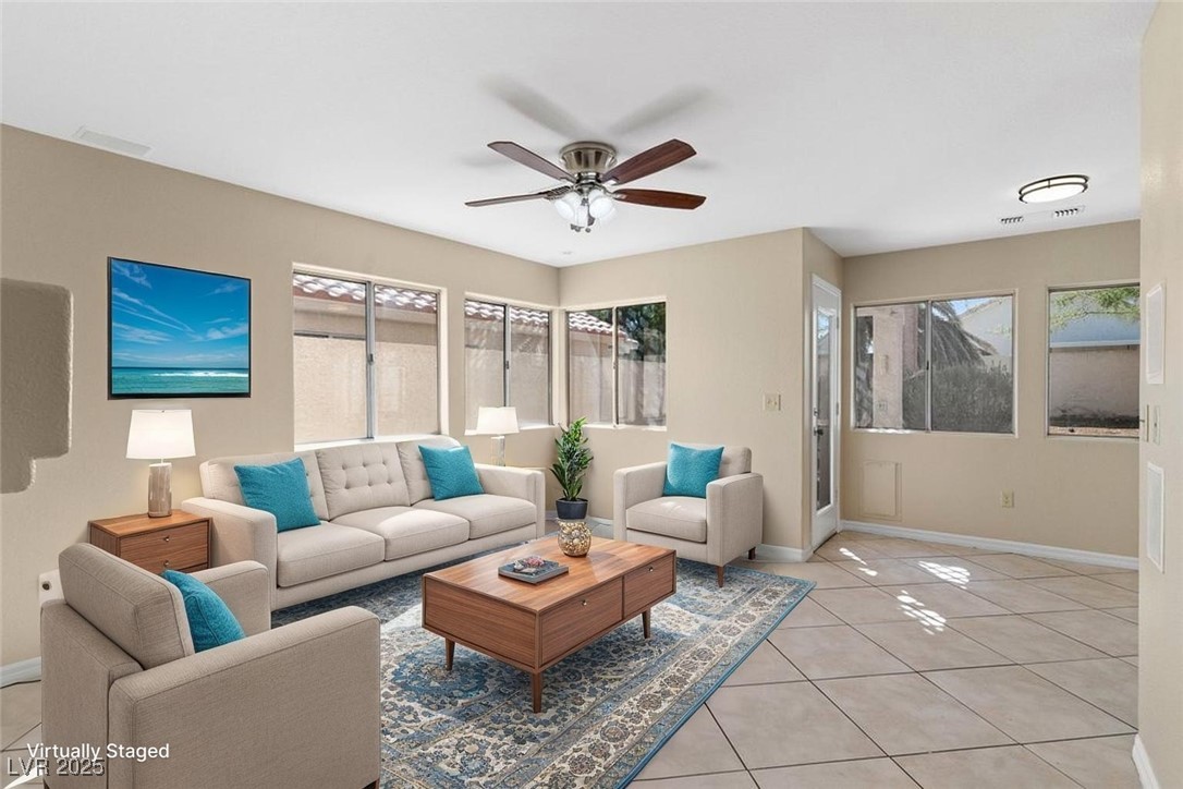 5309 West Camino Del Rancho Las Vegas, NV 89130 - Photo 5 of 41 Living room featuring light tile patterned flooring, ceiling fan, and plenty of natural light