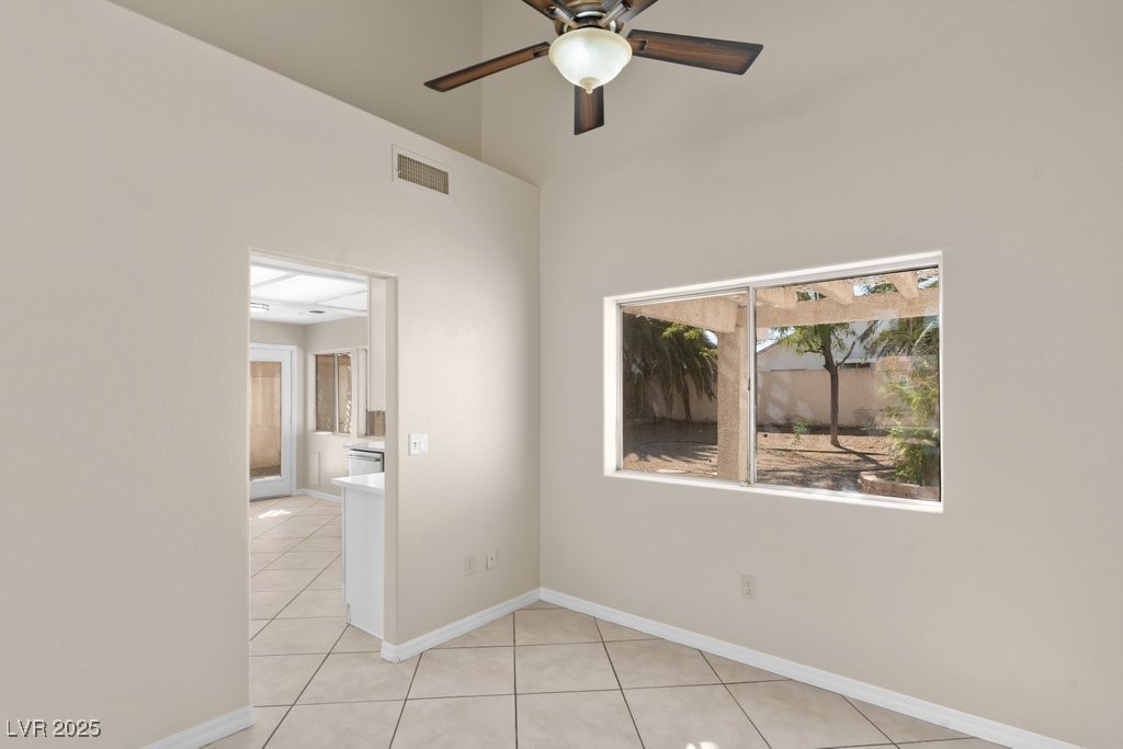 5309 West Camino Del Rancho Las Vegas, NV 89130 - Photo 9 of 41 Empty room featuring light tile patterned floors and ceiling fan