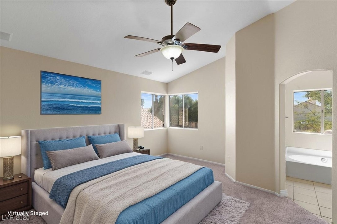 5309 West Camino Del Rancho Las Vegas, NV 89130 - Photo 10 of 41 Carpeted bedroom featuring lofted ceiling, a ceiling fan, and tile patterned floors
