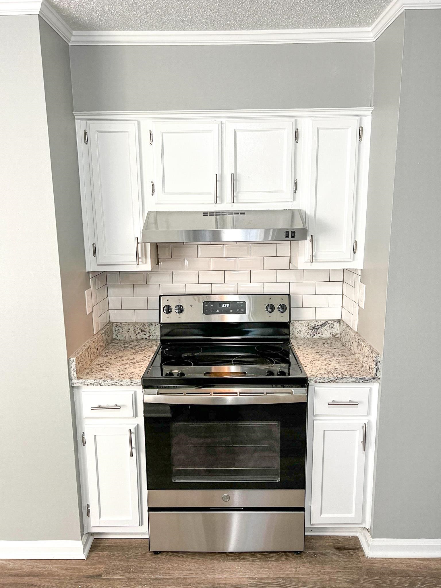 7108 Farmhouse Drive Memphis, TN 38125 - Photo 11 of 21 a stove top oven sitting inside of a kitchen