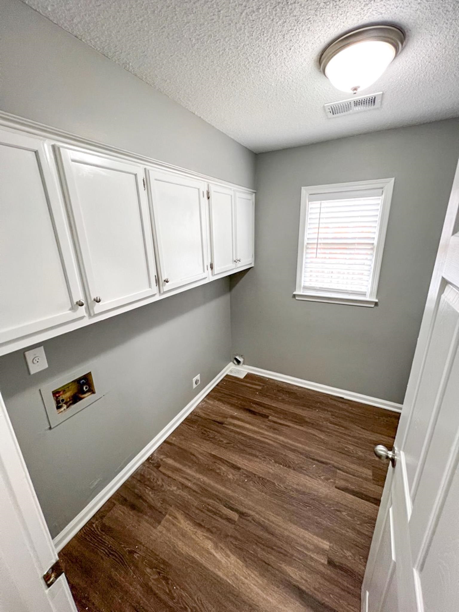 7108 Farmhouse Drive Memphis, TN 38125 - Photo 12 of 21 wooden floor in an empty room with a window