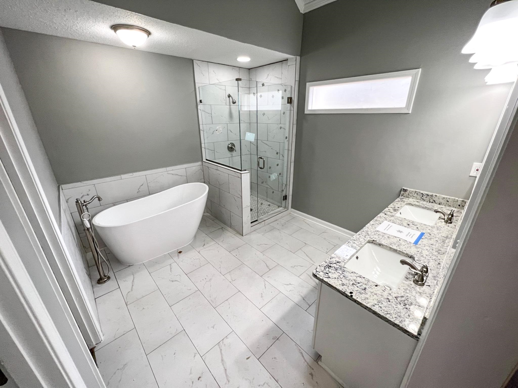 7108 Farmhouse Drive Memphis, TN 38125 - Photo 20 of 21 a bathroom with a granite countertop sink a toilet and shower