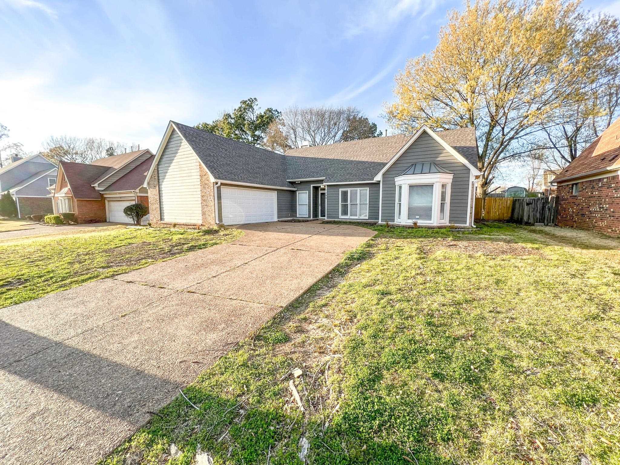7108 Farmhouse Drive Memphis, TN 38125 - Photo 2 of 21 front view of a house with a yard