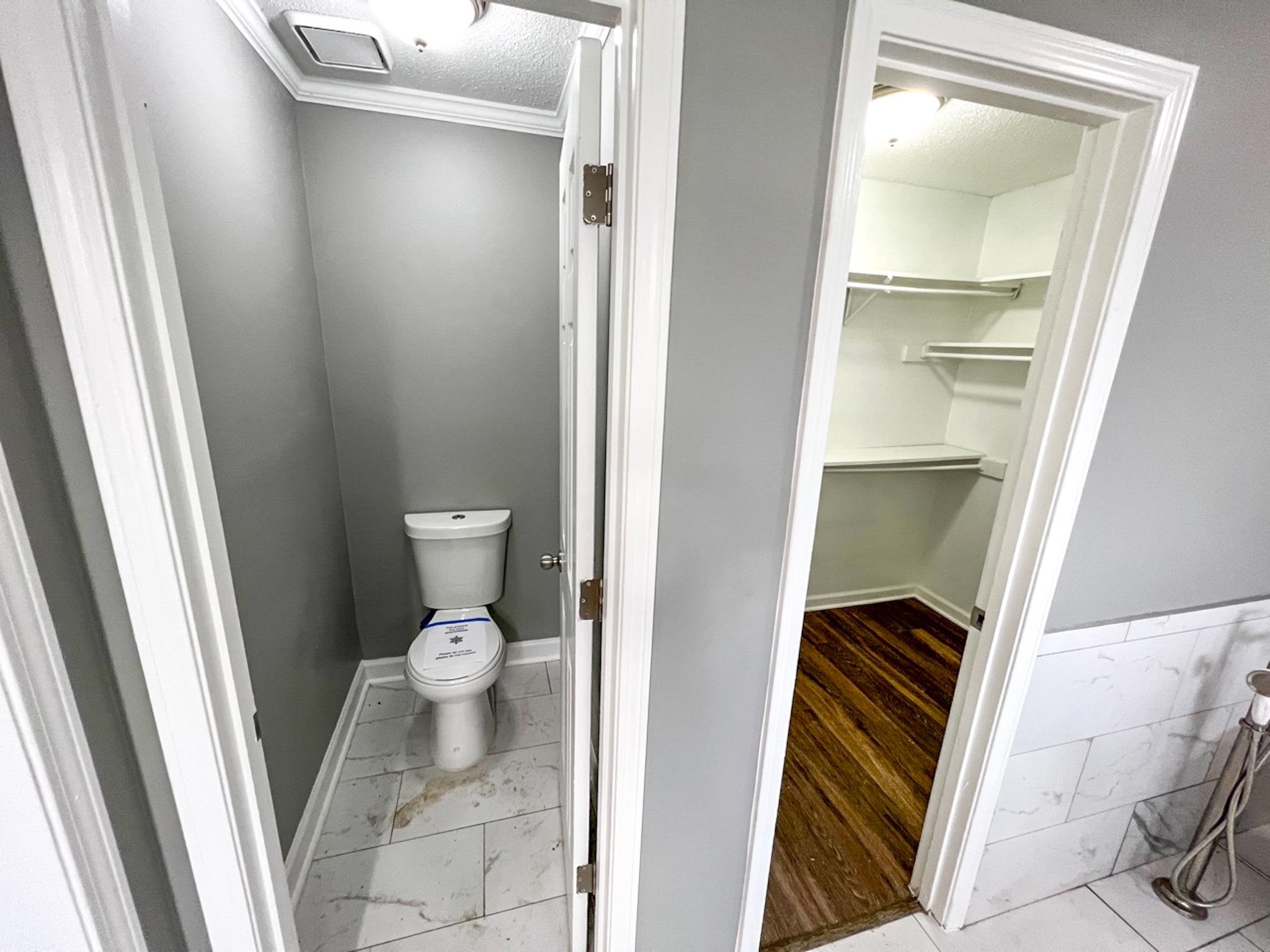 7108 Farmhouse Drive Memphis, TN 38125 - Photo 21 of 21 a bathroom with a toilet and a sink
