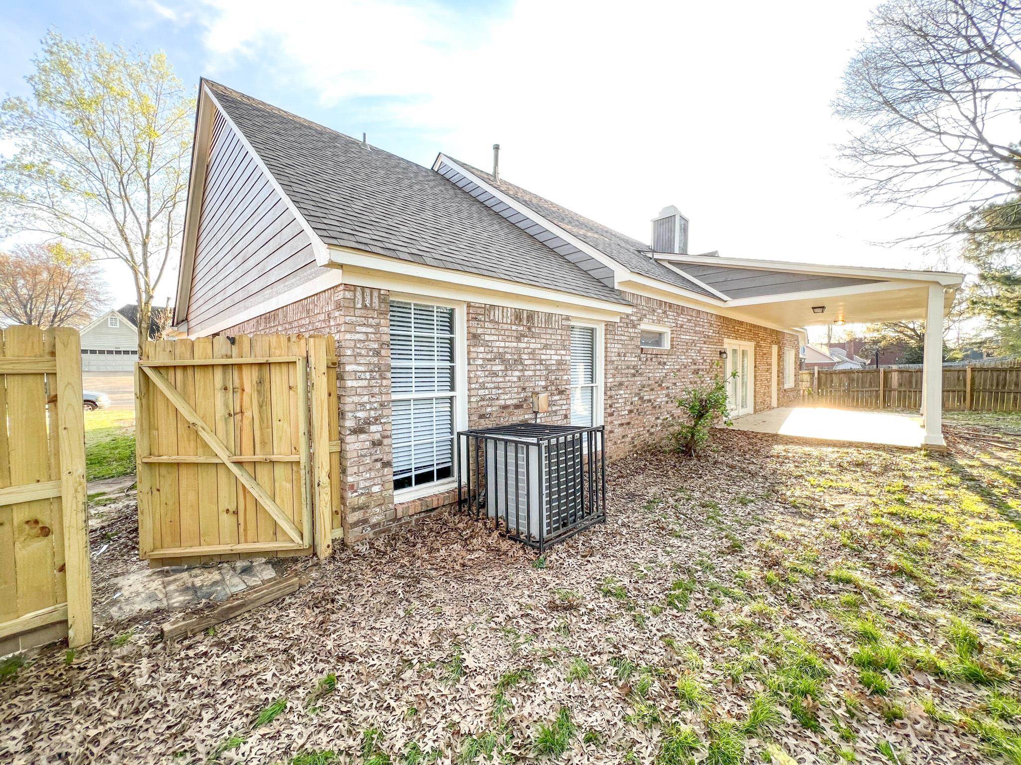7108 Farmhouse Drive Memphis, TN 38125 - Photo 5 of 21 a view of a house with a backyard