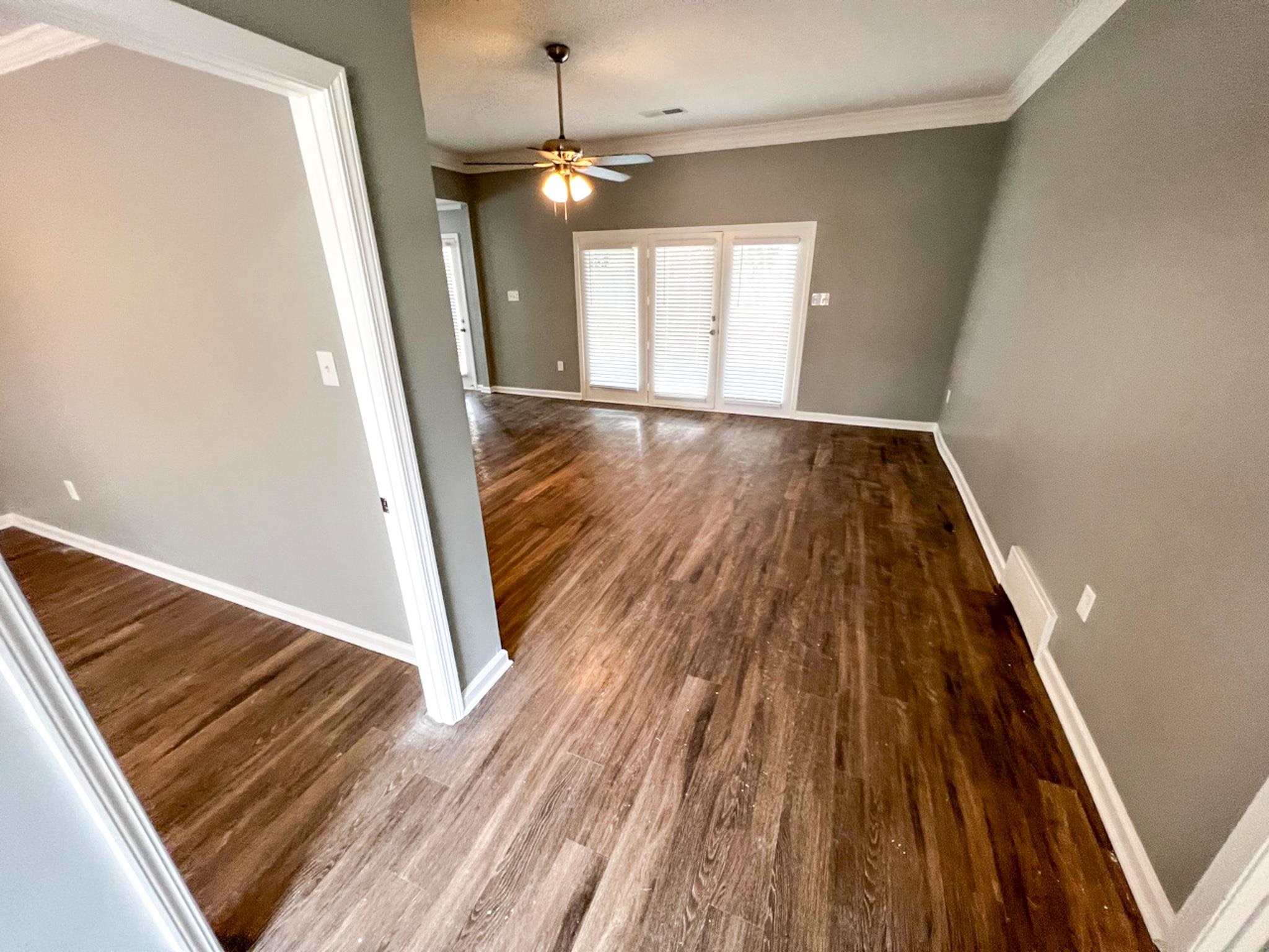 7108 Farmhouse Drive Memphis, TN 38125 - Photo 6 of 21 a view of a room with wooden floor and staircase