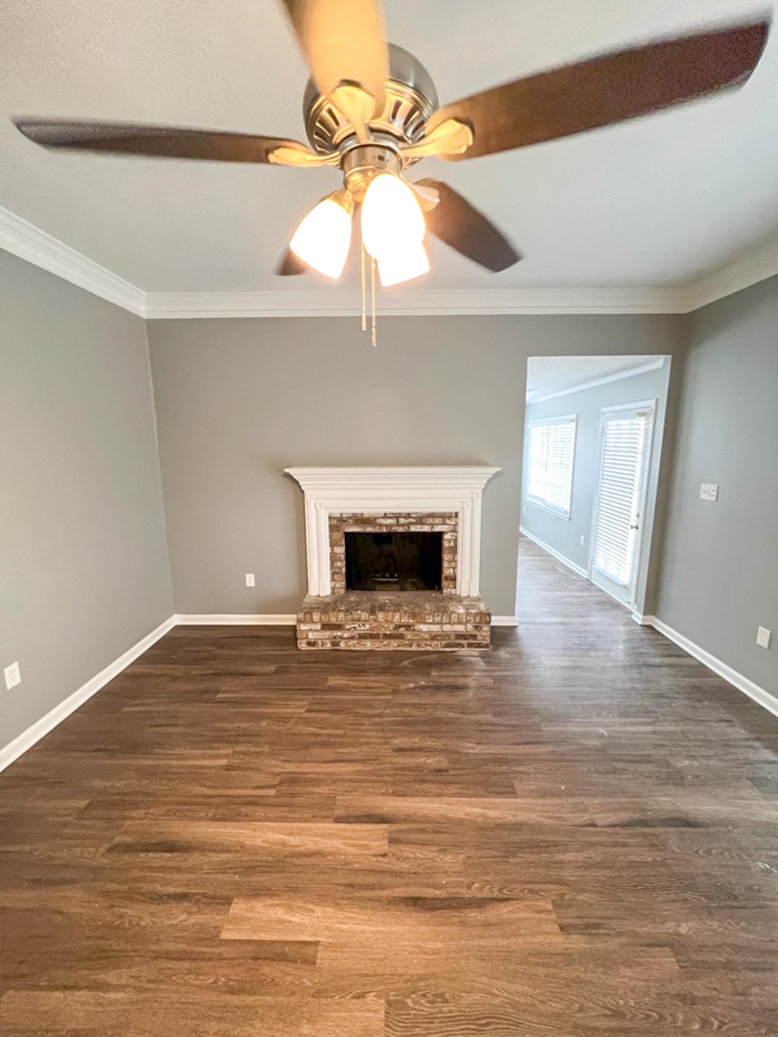 7108 Farmhouse Drive Memphis, TN 38125 - Photo 8 of 21 a view of empty room with wooden floor and fan