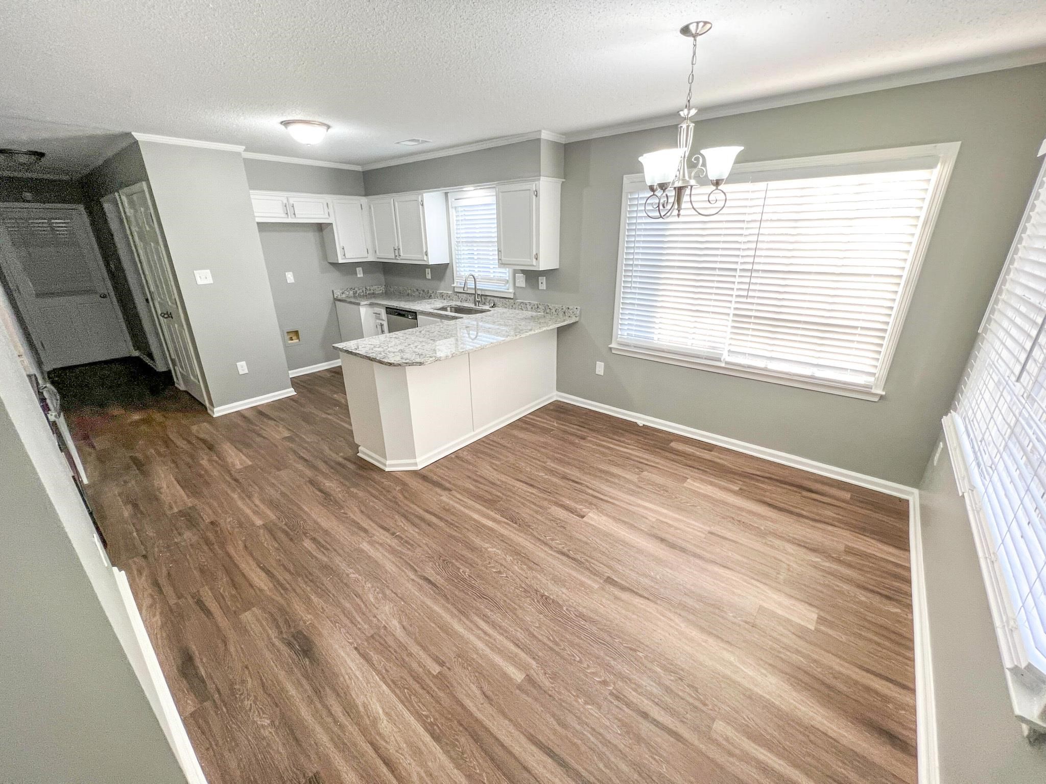 7108 Farmhouse Drive Memphis, TN 38125 - Photo 9 of 21 a kitchen with a refrigerator and window