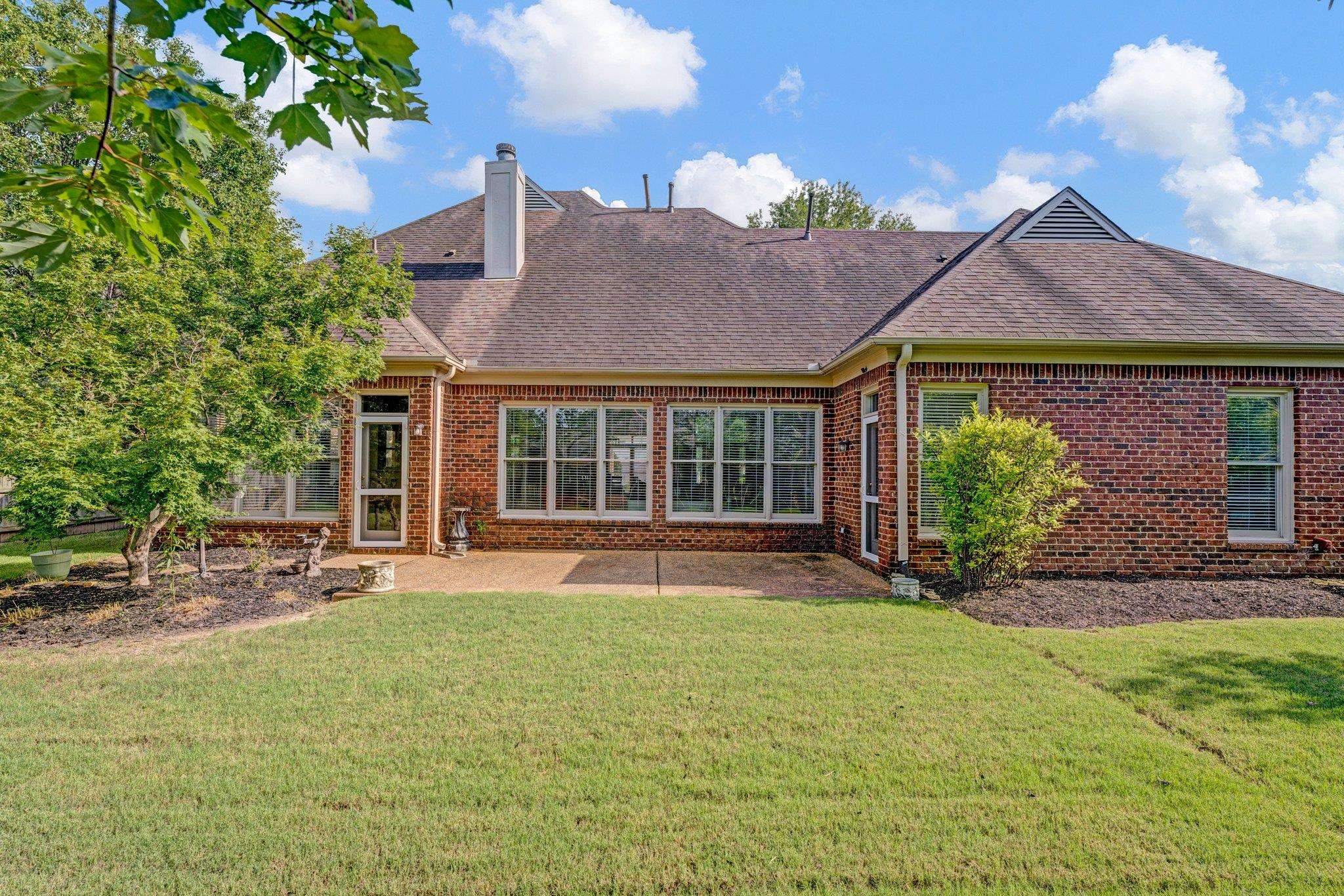 1331 Riding Brook Drive Collierville, TN 38017 - Photo 34 of 39 Back of property with a lawn