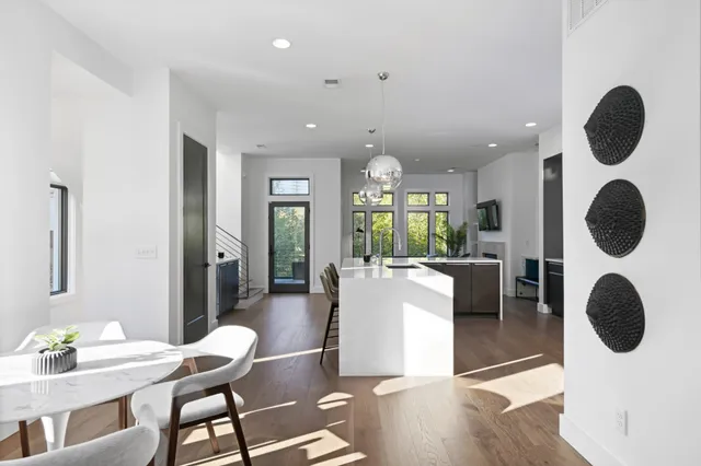 a view of kitchen and dining room with wooden floor