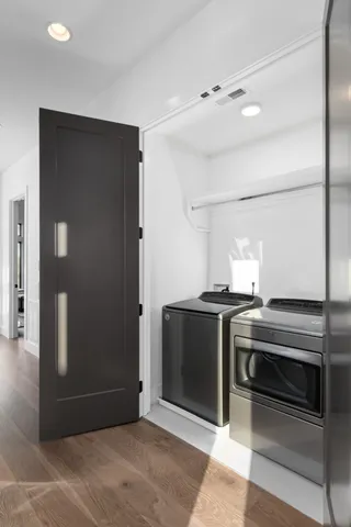 a view of kitchen with stove and refrigerator